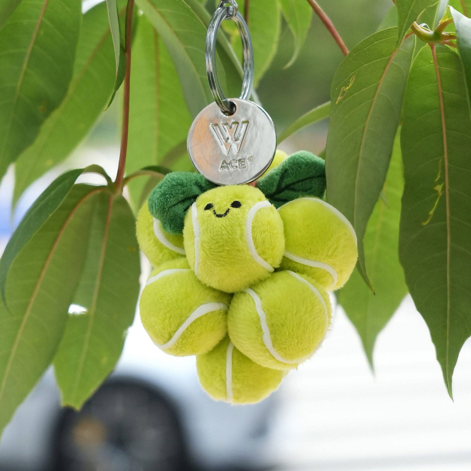 ace-tennis-balls-keychain-plush-tennis-ball-flower-charm-green-purple-cute-smiling-tennis-keyring-sports-bag-charm-tennis-gift-accessory-the-plushables